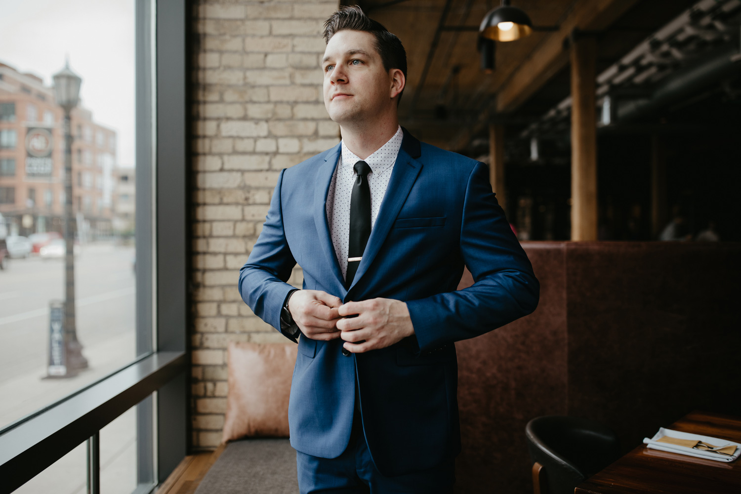 Groom getting ready at Hewing Hotel Minneapolis blue suit