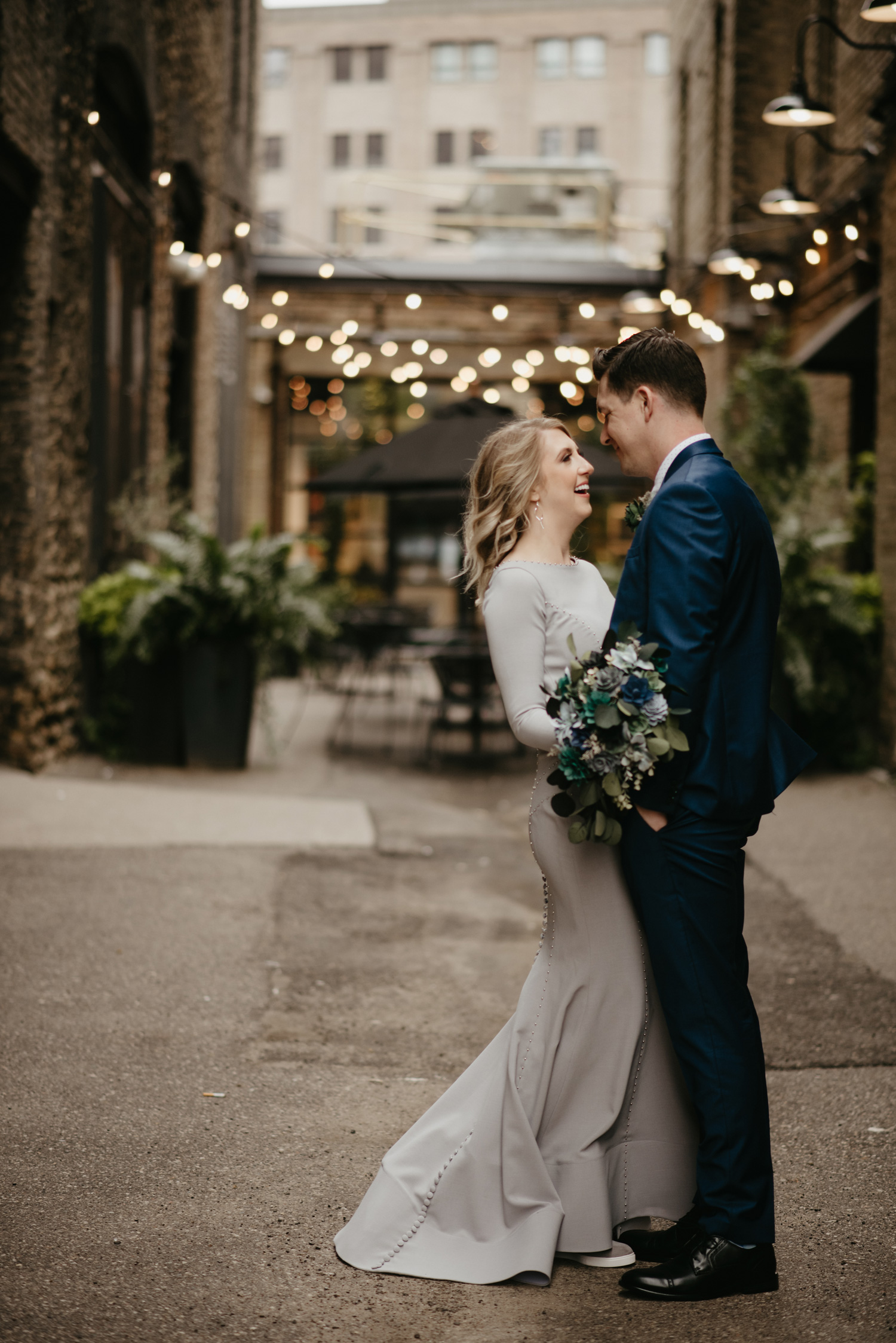 Bride and Groom in alleyway with cafe lights Downtown Minneapolis