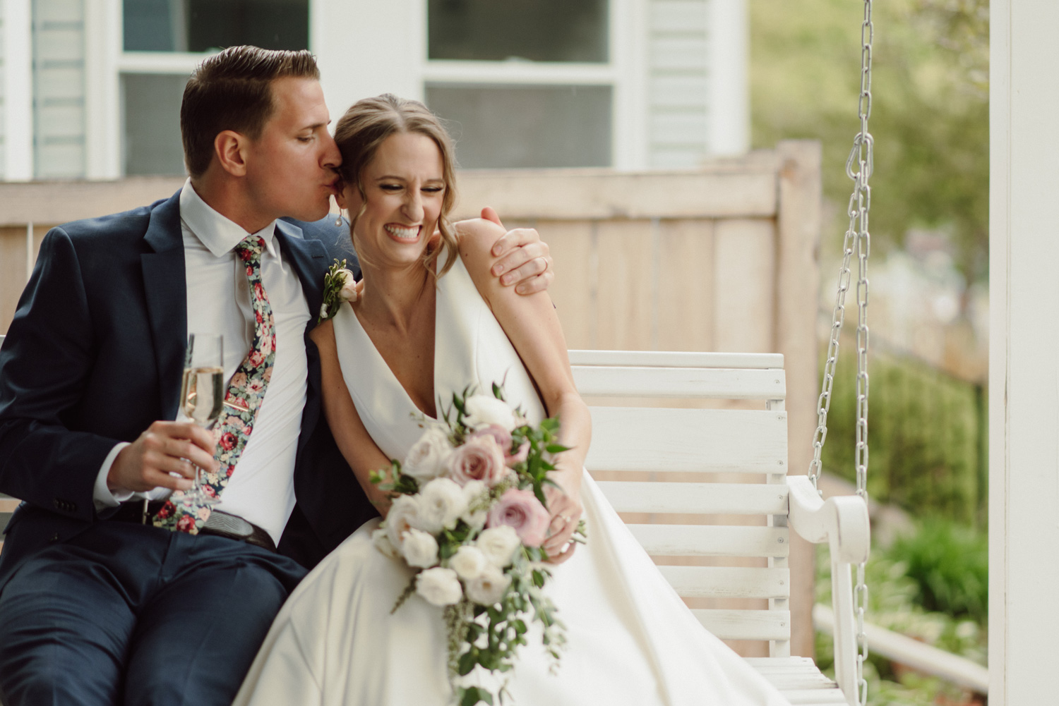 bride and groom on porch covid in home intimate wedding