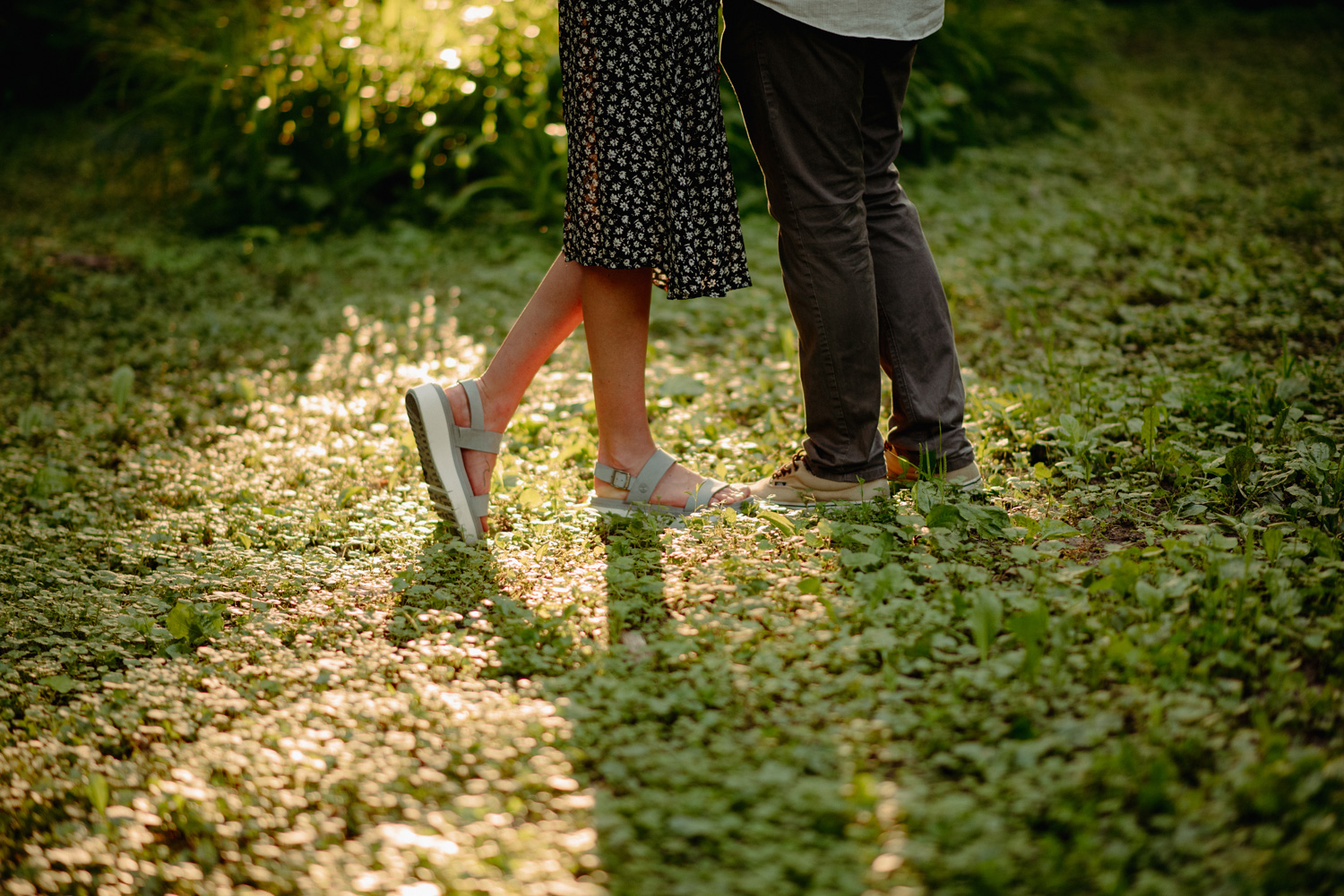 Engaged couple at a park summer minneapolis cedar lake