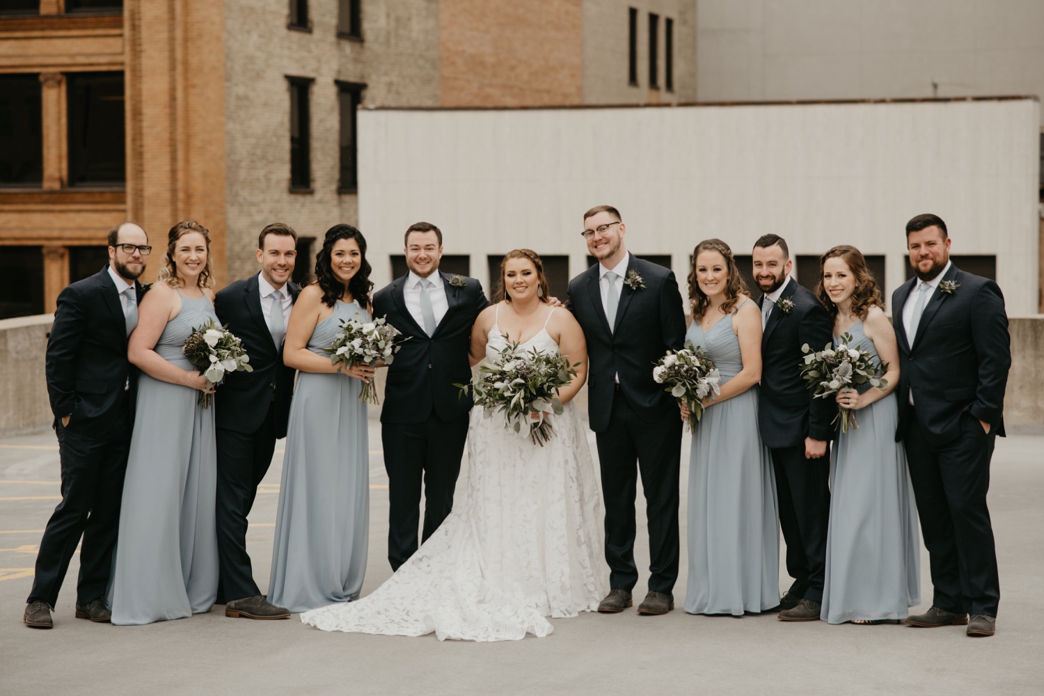 dusty blue and navy wedding party on a rooftop lumber exchange minneapolis