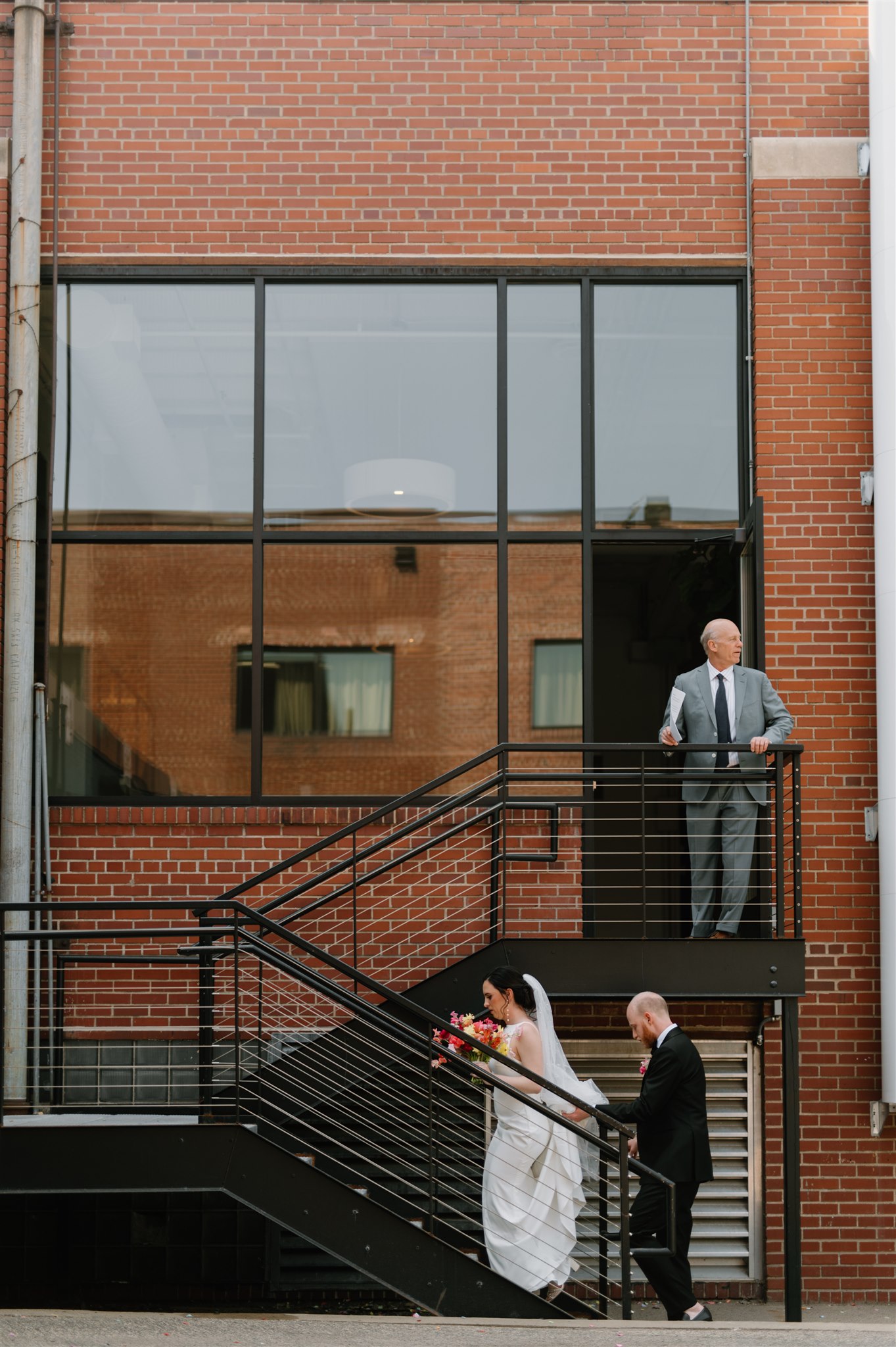bride groom walking up stairs