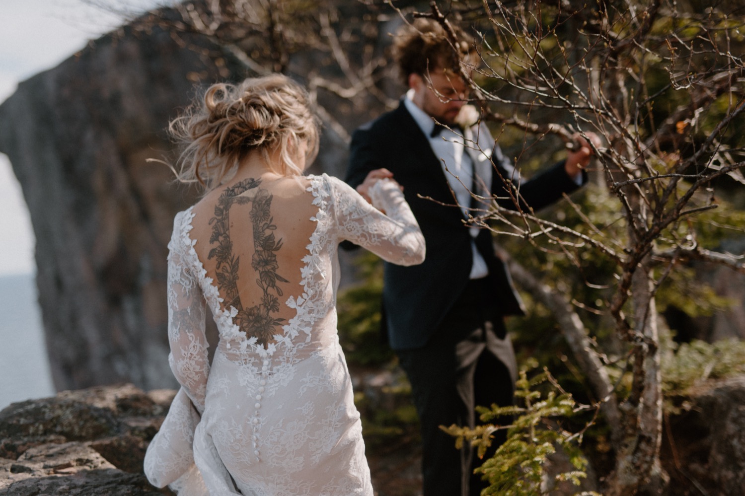 bride and groom walking outdoors in northern minnestoa