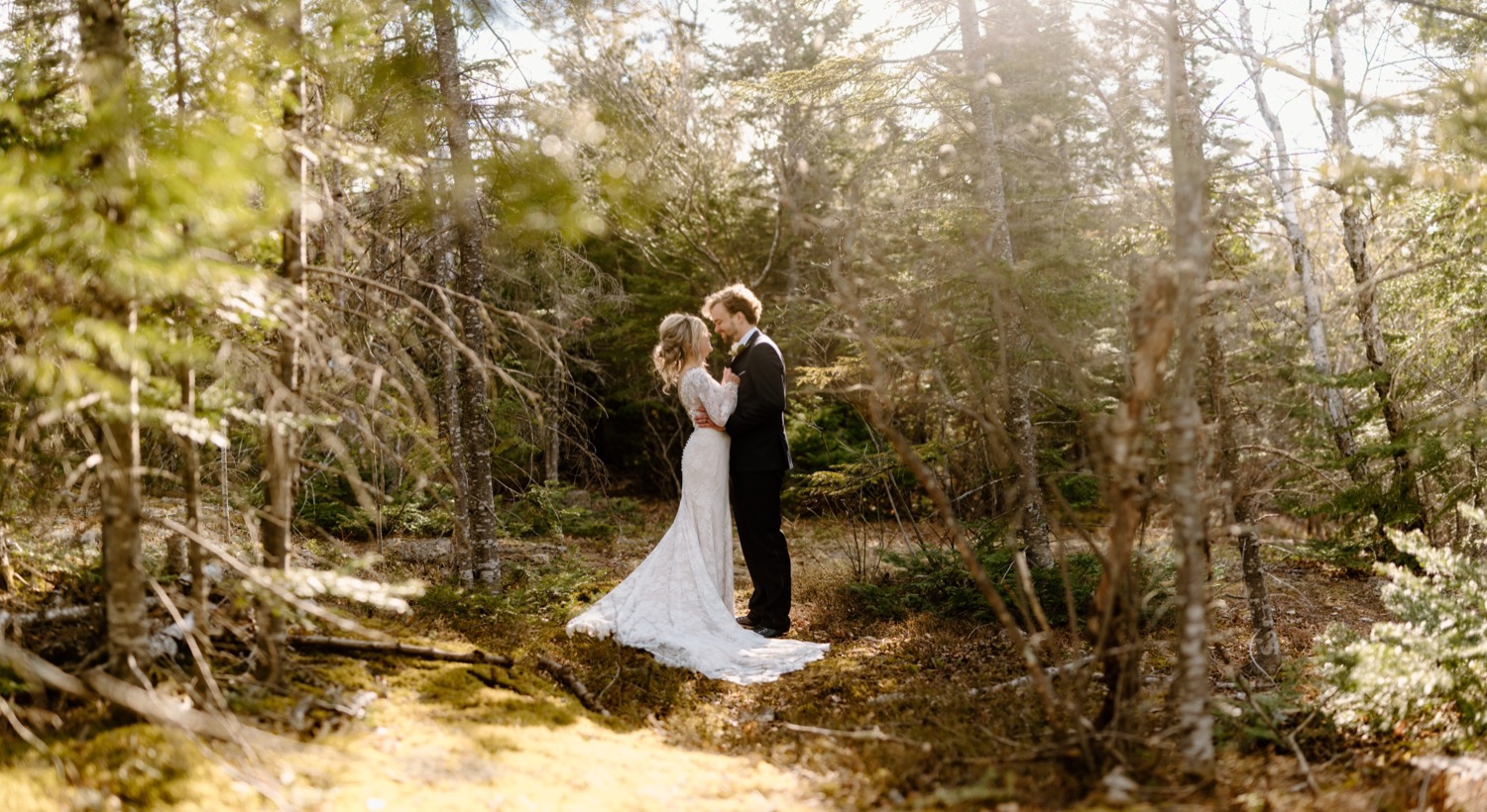 bride and groom hugging outdoors in northern minnesota